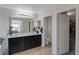 Main bathroom with double vanity, toilet and walk-in closet at 2404 Briggsdale Ave, North Las Vegas, NV 89081