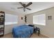 Bedroom with double bed, dresser, and plenty of natural light at 2404 Briggsdale Ave, North Las Vegas, NV 89081