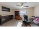 Bright bedroom with large window, dresser, and workspace at 2404 Briggsdale Ave, North Las Vegas, NV 89081