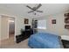 Bedroom with a double bed, dresser, and built-in shelving at 2404 Briggsdale Ave, North Las Vegas, NV 89081