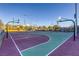 Dual basketball courts with hoops and painted lines at 2576 Desante Dr, Henderson, NV 89044