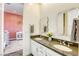 Elegant bathroom with double vanity and decorative mirrors at 2576 Desante Dr, Henderson, NV 89044