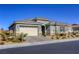 One story home with neutral color scheme and landscaping at 2576 Desante Dr, Henderson, NV 89044