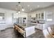 Modern kitchen with white cabinets, large island, and stainless steel appliances at 2576 Desante Dr, Henderson, NV 89044