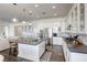 Modern kitchen with white cabinets and island at 2576 Desante Dr, Henderson, NV 89044