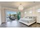 Bright and airy main bedroom with sliding glass doors at 2576 Desante Dr, Henderson, NV 89044