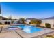 Stunning pool and spa with waterfall feature in a well-landscaped backyard at 2576 Desante Dr, Henderson, NV 89044