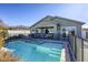 Clean lines and a beautiful backyard pool with a spa and safety fence at 2576 Desante Dr, Henderson, NV 89044