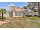 House exterior featuring a grassy backyard and covered patio at 2617 Huber Heights Dr, Las Vegas, NV 89128