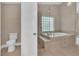 Elegant bathroom with soaking tub, walk-in shower, and modern fixtures at 2617 Huber Heights Dr, Las Vegas, NV 89128