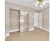 Bright bedroom with mirrored closet doors and wood-look flooring at 2617 Huber Heights Dr, Las Vegas, NV 89128