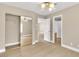 Bedroom featuring wood flooring, closet, and connecting doors, with a ceiling fan at 2617 Huber Heights Dr, Las Vegas, NV 89128