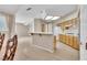 Open-concept living room featuring carpet, view to kitchen and dining room at 2617 Huber Heights Dr, Las Vegas, NV 89128