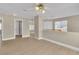 Bright loft space featuring light wood flooring, neutral walls, and ceiling fan at 2617 Huber Heights Dr, Las Vegas, NV 89128