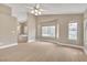 Expansive main bedroom featuring hardwood floors, neutral paint, and ceiling fan, leading into a luxurious ensuite bathroom at 2617 Huber Heights Dr, Las Vegas, NV 89128