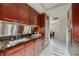 Modern kitchen with granite countertops and wood cabinetry at 2700 Las Vegas Blvd # 2006, Las Vegas, NV 89109