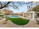 Spacious backyard featuring a pool, pergola, and artificial turf at 3105 Conners Dr, Las Vegas, NV 89107