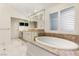 Elegant bathroom with soaking tub and custom cabinetry at 3105 Conners Dr, Las Vegas, NV 89107