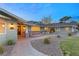 House exterior showcasing a walkway to the front door, landscaping, and brick accents at 3105 Conners Dr, Las Vegas, NV 89107