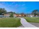 Home exterior featuring a landscaped lawn and brick walkway leading to the entrance at 3105 Conners Dr, Las Vegas, NV 89107