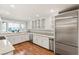 Modern kitchen with stainless steel appliances and white cabinetry at 3105 Conners Dr, Las Vegas, NV 89107