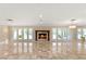 Elegant living room with fireplace and large windows at 3105 Conners Dr, Las Vegas, NV 89107