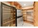 Well-organized pantry with ample shelving and wine cooler at 3105 Conners Dr, Las Vegas, NV 89107