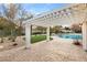 Relaxing pergola with brick pavers, offering shade and a view of the pool at 3105 Conners Dr, Las Vegas, NV 89107