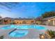 Inviting pool and spa with flagstone decking at night at 3105 Conners Dr, Las Vegas, NV 89107