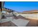 Backyard with covered patio, gravel, and block wall at 321 Carrington St, Henderson, NV 89074