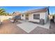 Backyard view showcasing a patio, gravel landscaping, and AC unit at 321 Carrington St, Henderson, NV 89074