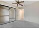 Spacious bedroom with mirrored closet and ceiling fan at 321 Carrington St, Henderson, NV 89074