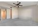 Large bedroom with ceiling fan and carpet flooring at 321 Carrington St, Henderson, NV 89074