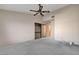 Spacious bedroom with ceiling fan and mirrored closet doors at 321 Carrington St, Henderson, NV 89074