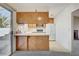 Kitchen boasts wood cabinets and a breakfast bar at 321 Carrington St, Henderson, NV 89074