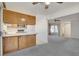 Kitchen with breakfast bar, wood cabinets, and appliances at 321 Carrington St, Henderson, NV 89074