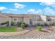 Backyard view showcasing a patio area, desert landscaping, and a gravel pathway at 3236 Mystic Ridge Ct, Las Vegas, NV 89129