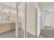 Double vanity bathroom with mirrored cabinet and hallway view at 3236 Mystic Ridge Ct, Las Vegas, NV 89129