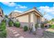 Exterior of the home, showcasing a walkway, landscaping and a staircase leading to the entrance at 3236 Mystic Ridge Ct, Las Vegas, NV 89129