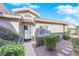 Front yard with a walkway leading to the entrance, neatly trimmed shrubs and a stone pathway at 3236 Mystic Ridge Ct, Las Vegas, NV 89129