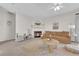 Cozy living room with a fireplace and neutral decor at 3236 Mystic Ridge Ct, Las Vegas, NV 89129