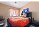 Bright bedroom with a double bed and orange bedding at 3327 Outlook Point St, North Las Vegas, NV 89032