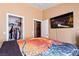 Bedroom with large closet, TV and basketball bedding at 3327 Outlook Point St, North Las Vegas, NV 89032