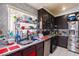 Kitchen with dark wood cabinets, a sink, and stainless steel appliances at 3327 Outlook Point St, North Las Vegas, NV 89032