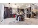 Kitchen with dark brown cabinets, an island, and stainless steel appliances at 3327 Outlook Point St, North Las Vegas, NV 89032