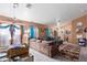 Bright living area with sectional sofa, decorative accents, and entryway view at 3327 Outlook Point St, North Las Vegas, NV 89032