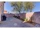 Landscaped backyard with a brick patio and grill at 3728 Spiritual Way, Las Vegas, NV 89115