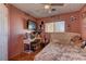 Bright bedroom with a comfortable bed, a vanity, and large TV at 3728 Spiritual Way, Las Vegas, NV 89115