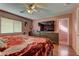 Main bedroom with large bed, wood dresser, and ceiling fan at 3728 Spiritual Way, Las Vegas, NV 89115