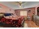 Main bedroom with large bed, wood dresser, and ceiling fan at 3728 Spiritual Way, Las Vegas, NV 89115